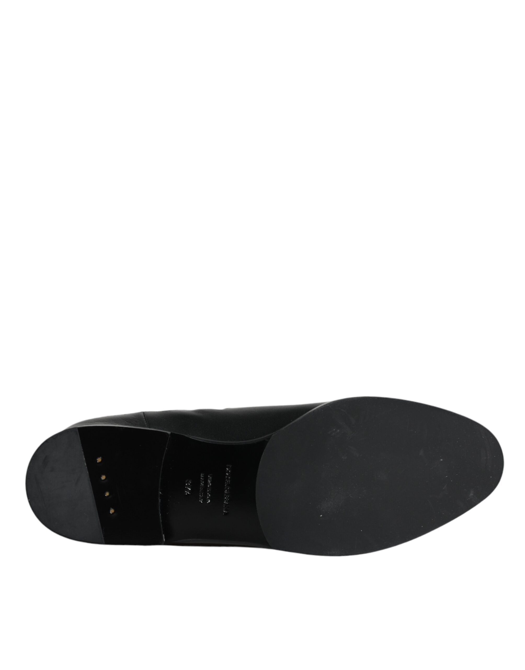 Black leather mid-calf boots with logo detail from Dolce & Gabbana, showcasing stylish footwear with sleek design and sturdy heels.