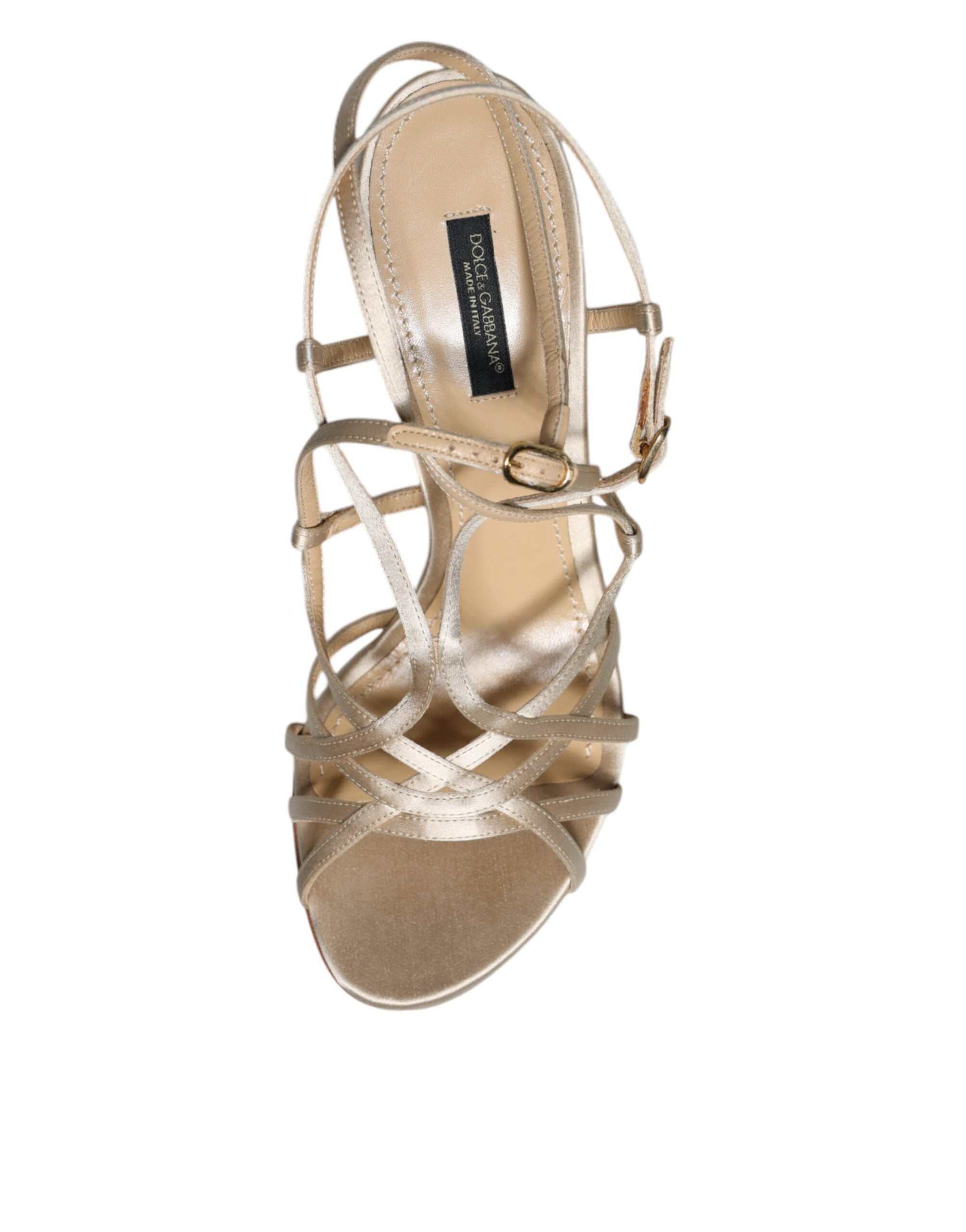 Beige leather stiletto heels sandals by Dolce & Gabbana with ankle straps and sleek design.