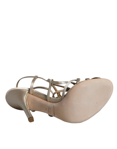 Beige leather stiletto heel sandals by Dolce & Gabbana, featuring sleek design and open toe style.