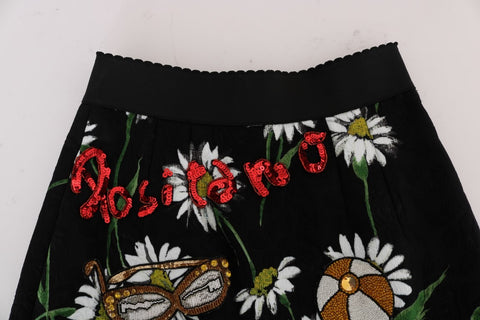 Black embellished daisy brocade skirt by Dolce & Gabbana with intricate floral patterns and decorative embellishments.
