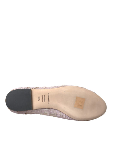 Pink lace crystal ballet flats loafers from Dolce & Gabbana with delicate lace and sparkling embellishments.