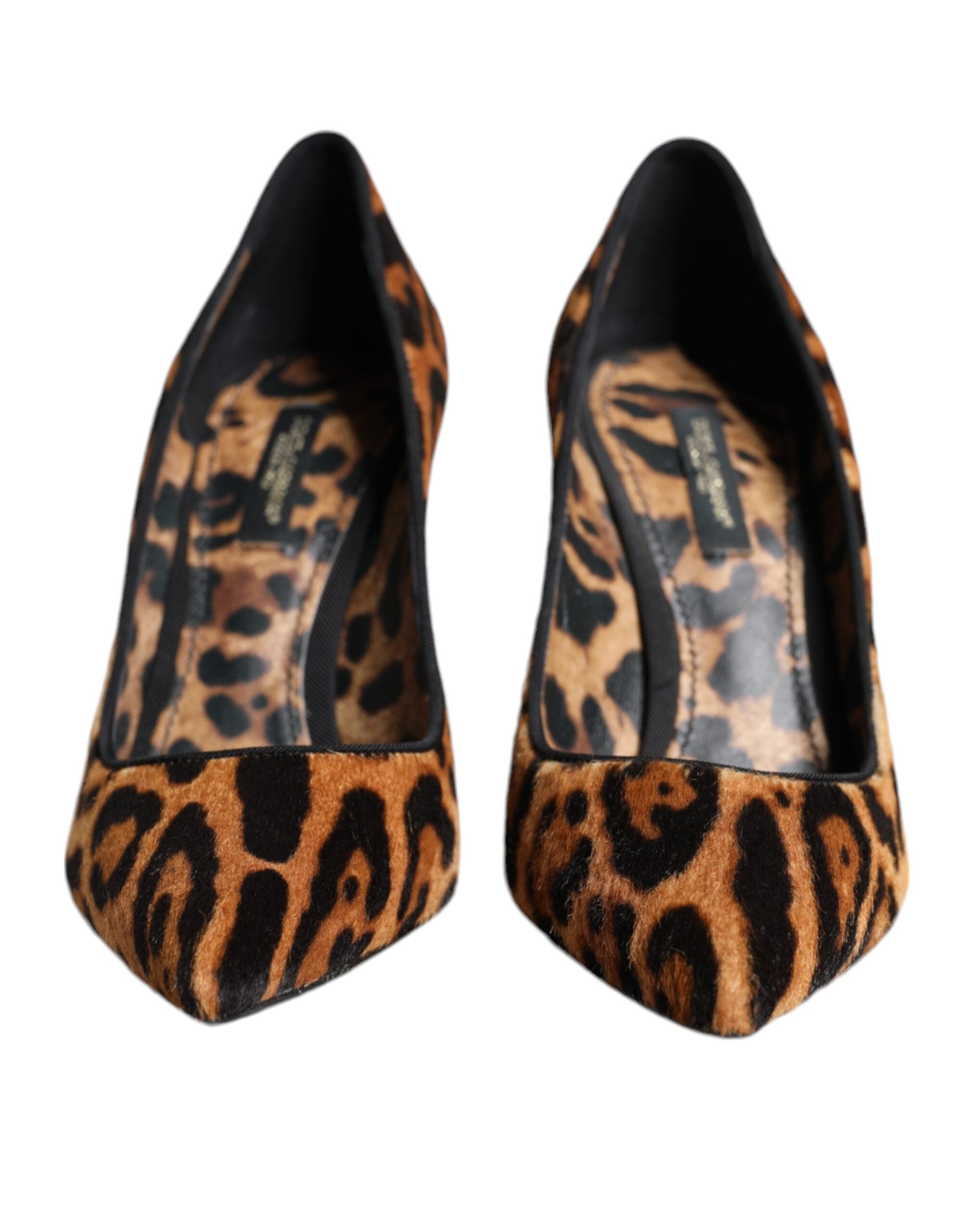 Brown leopard print calf hair heels by Dolce & Gabbana with pointed toe and stiletto heel, stylish and luxurious footwear.