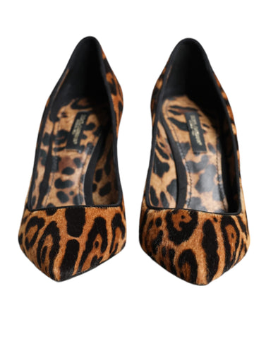Brown leopard print calf hair heels by Dolce & Gabbana with pointed toe and stiletto heel, stylish and luxurious footwear.