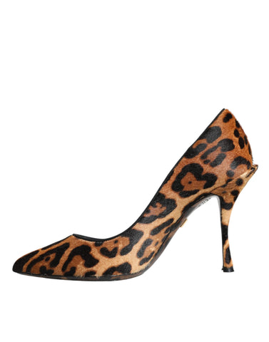 Brown leopard calf hair heels pumps with pointed toes and stiletto heels, designed by Dolce & Gabbana.