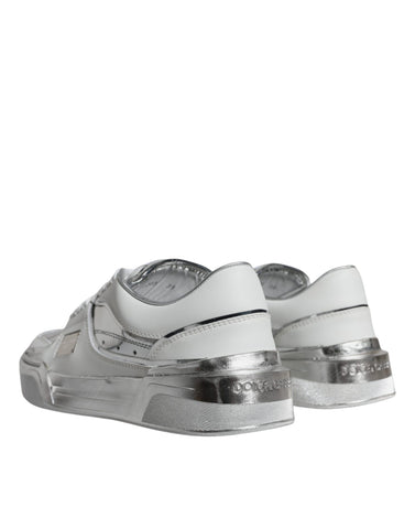 White silver leather low top sneakers by Dolce & Gabbana, featuring sleek design and casual athletic style.