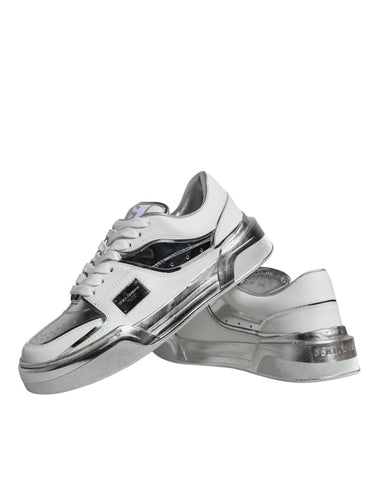 White silver leather low top sneakers by Dolce & Gabbana with sleek design and lace-up closure.