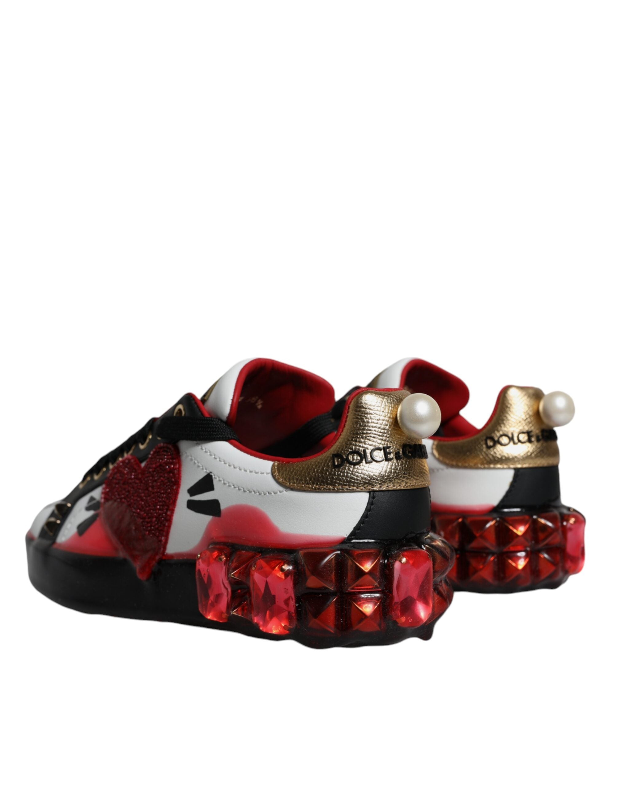Dolce & Gabbana Portofino sneakers with white leather, red crystal accents, and stylish sneaker design.