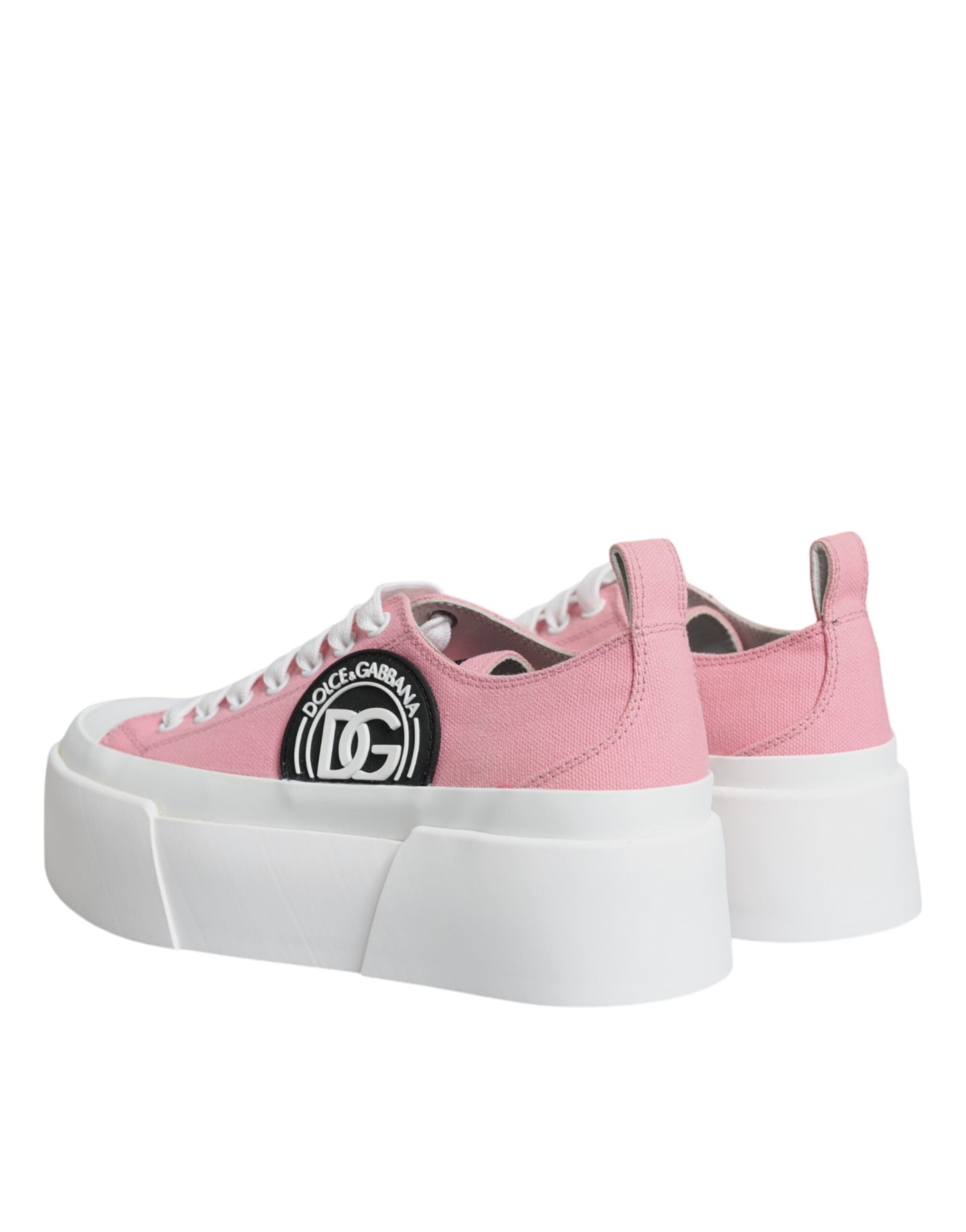 Pink and white canvas low-top sneakers by Dolce & Gabbana featuring logo detailing and casual style.