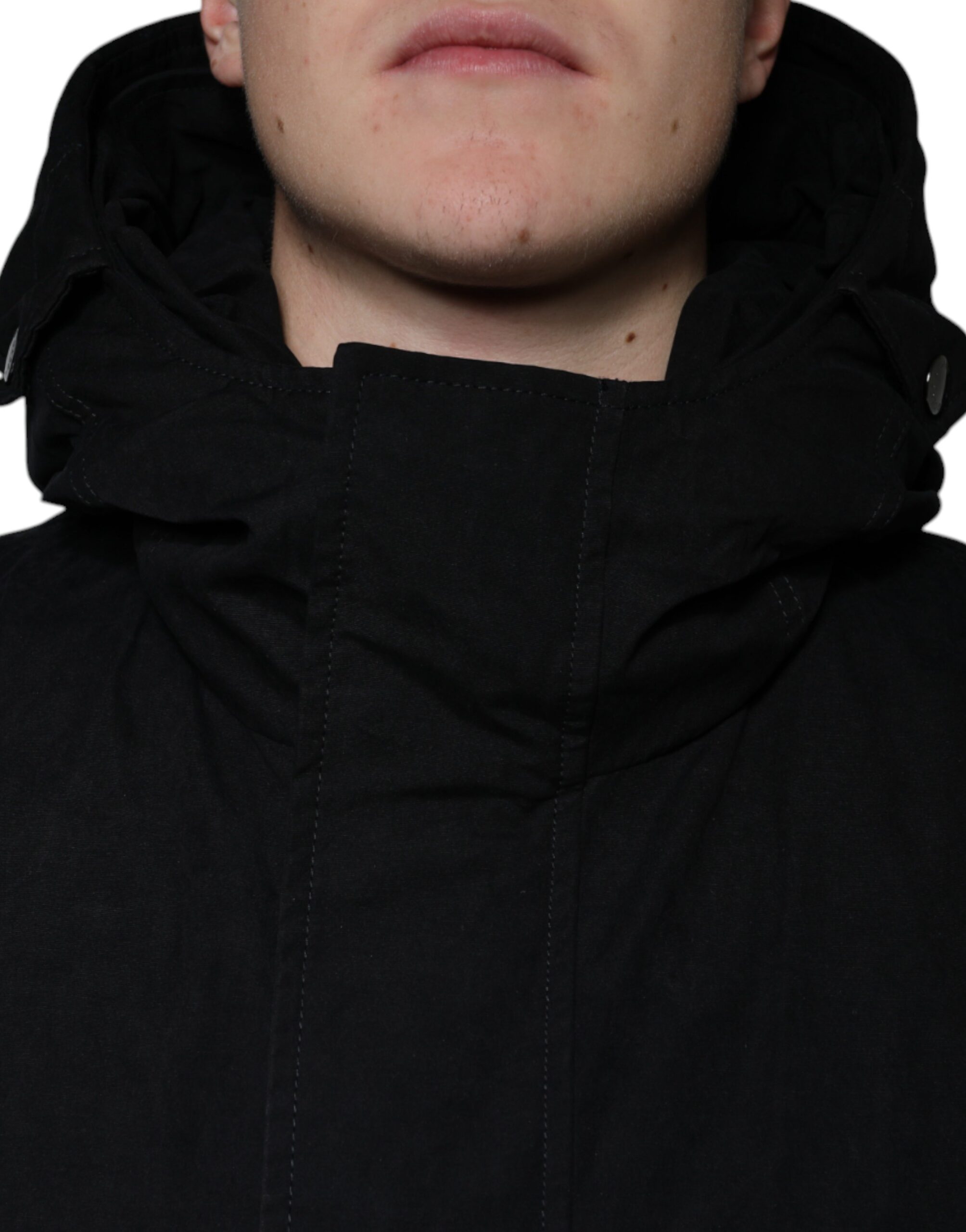 Black hooded parka cotton trench coat jacket by Dolce & Gabbana, featuring a hood, button closures, and a sleek, tailored fit.