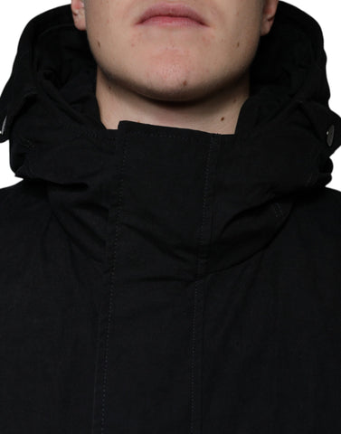 Black hooded parka cotton trench coat jacket by Dolce & Gabbana, featuring a hood, button closures, and a sleek, tailored fit.