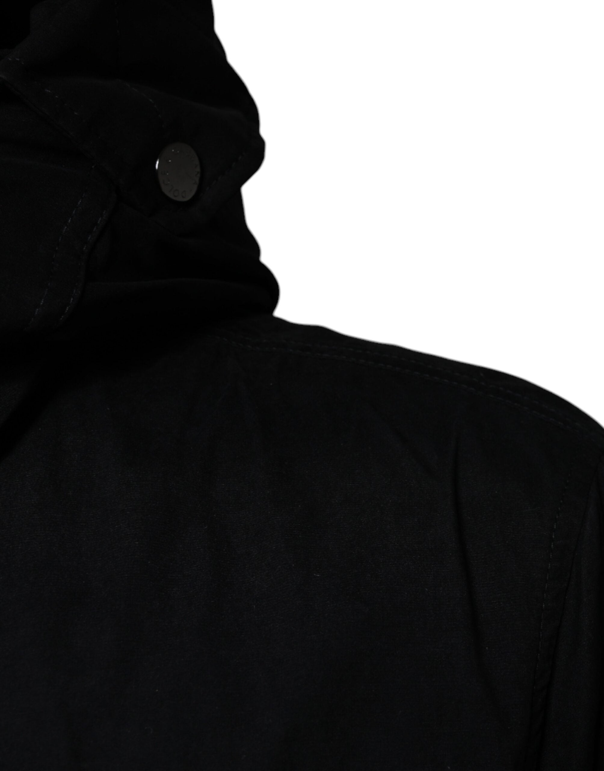 Black hooded parka cotton trench coat jacket by Dolce & Gabbana, featuring a sleek design with a hood and button closure.