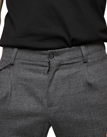 Gray check tartan wool skinny pants by Dolce & Gabbana with a fitted design and classic plaid pattern.