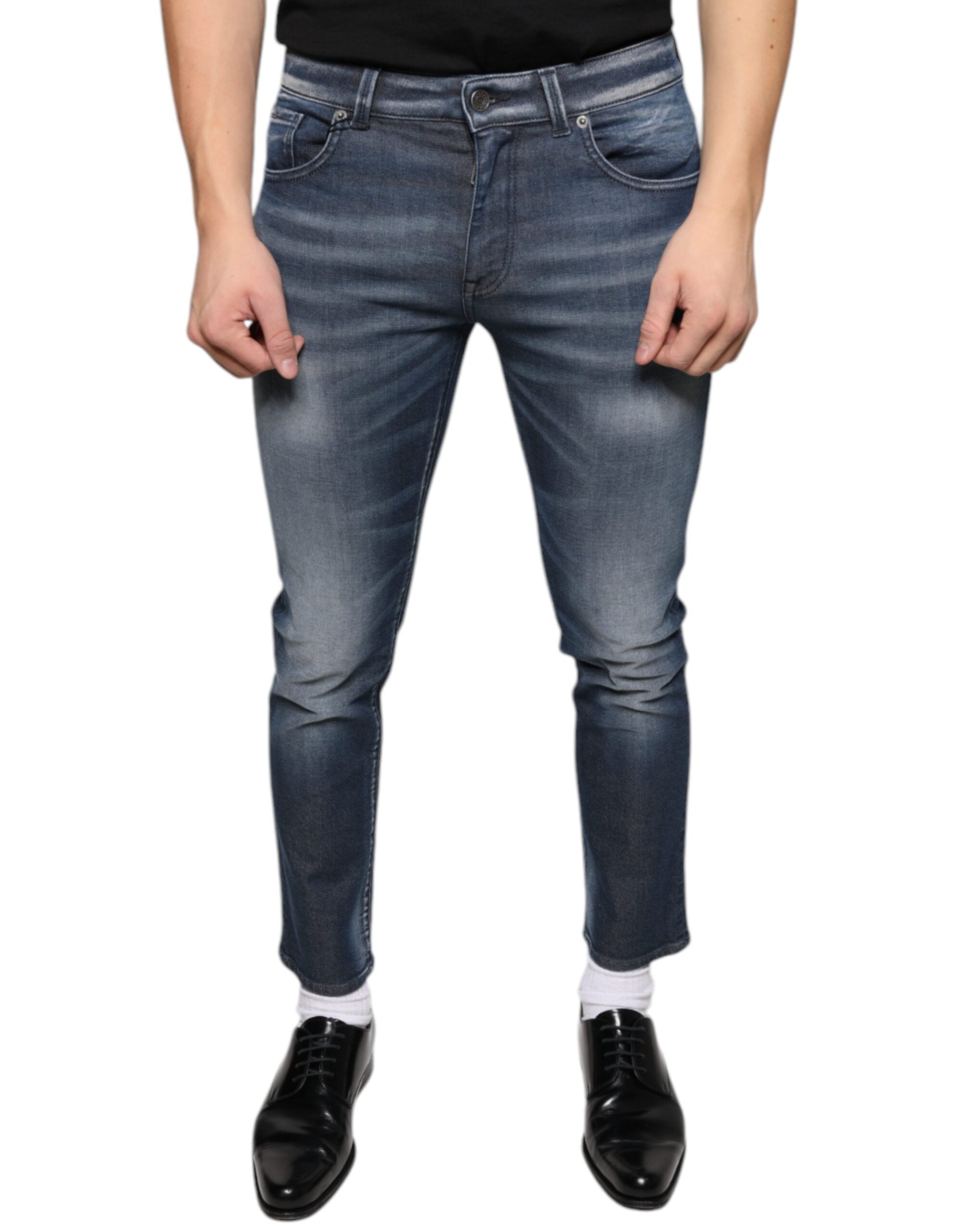 Dark blue washed cotton skinny denim jeans by Dolce & Gabbana displayed on a model.