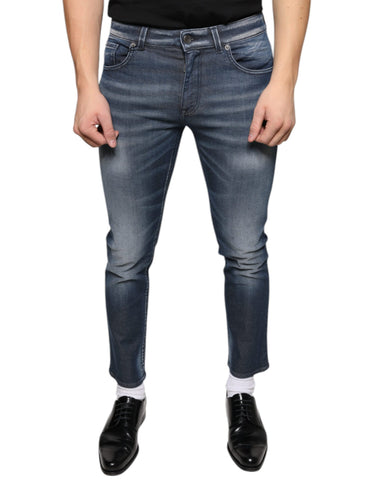 Dark blue washed cotton skinny denim jeans by Dolce & Gabbana displayed on a model.