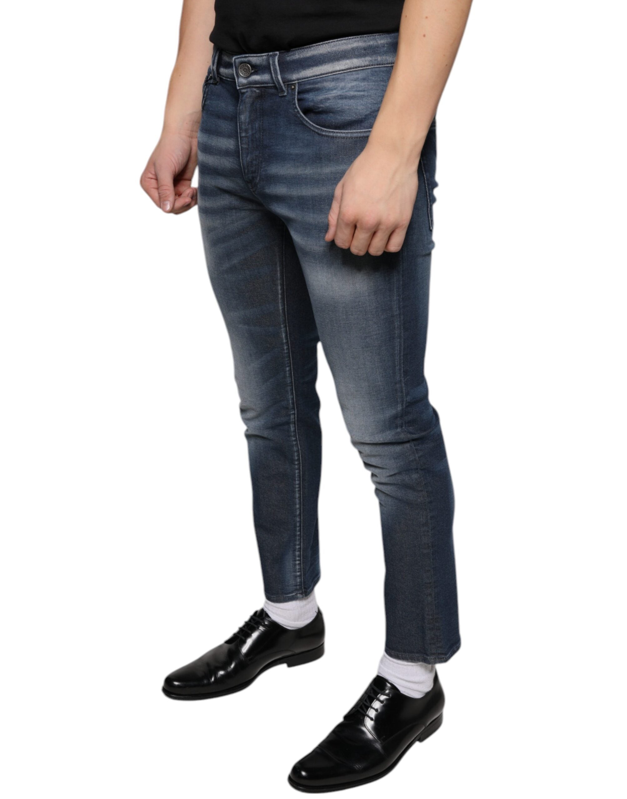 Dark blue washed cotton skinny denim jeans by Dolce & Gabbana, close-up showing fit and texture of the fabric.