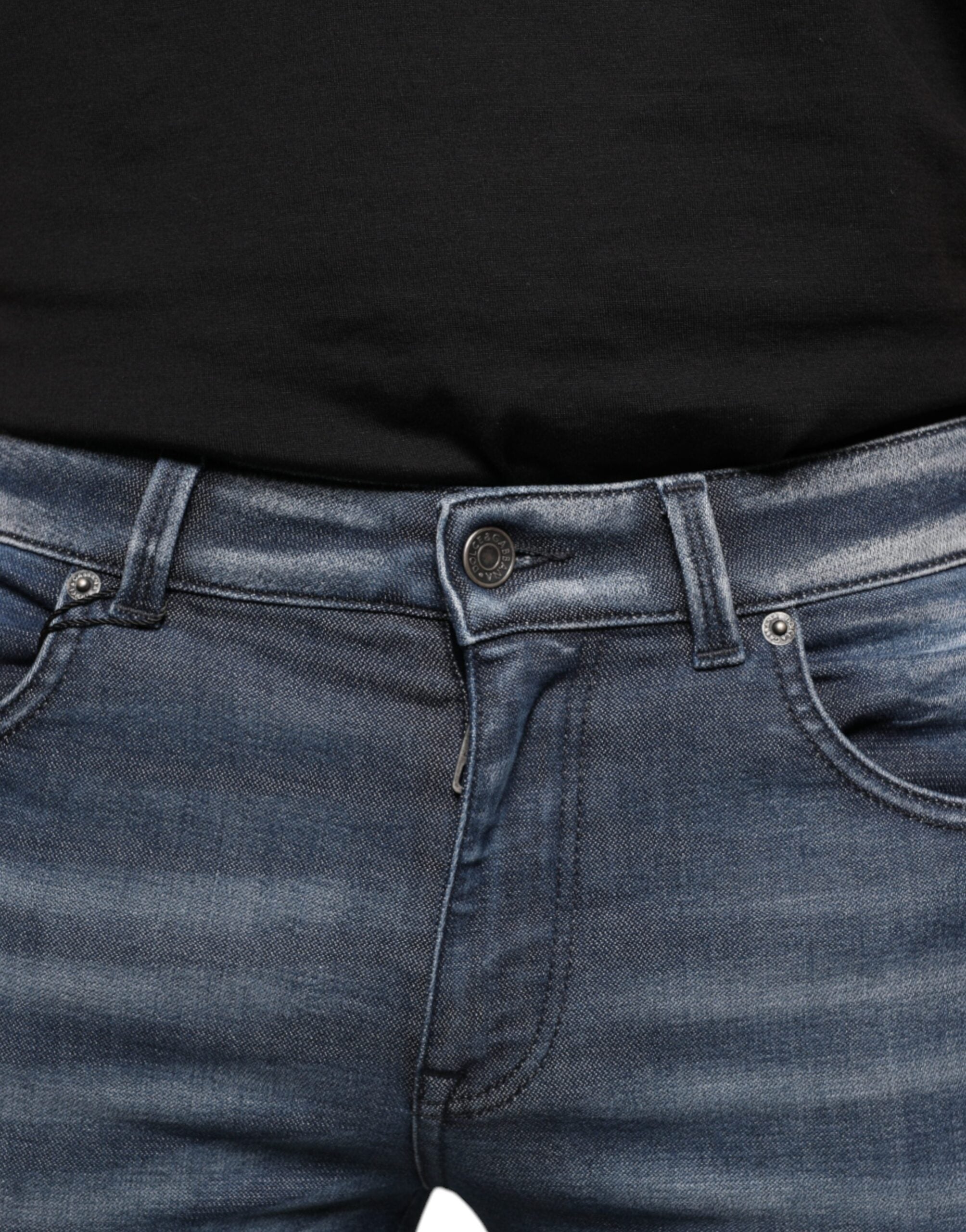 Dark blue washed cotton skinny denim jeans by Dolce & Gabbana, showing fitted style, front pockets, and classic stitching.