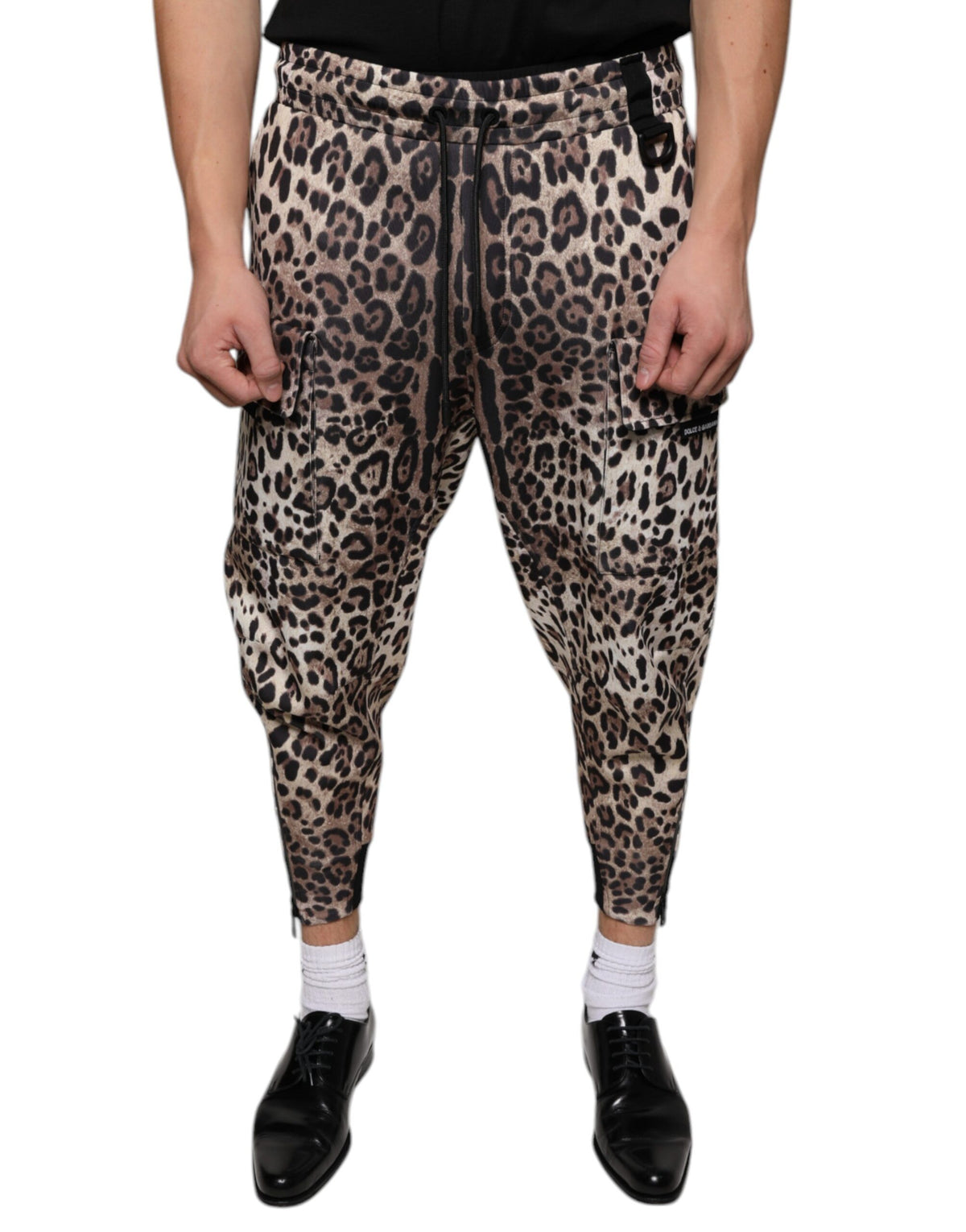 Brown leopard print polyester jogger pants by Dolce & Gabbana, featuring a relaxed fit and elastic waistband.