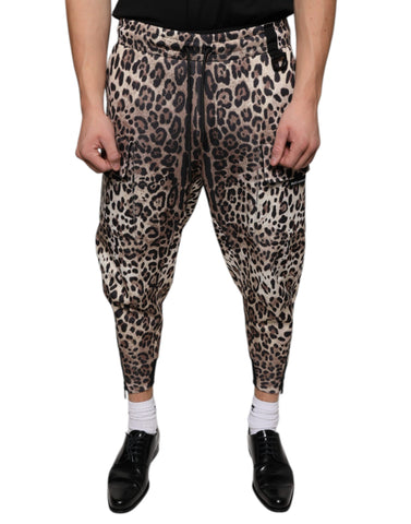Brown leopard print polyester jogger pants by Dolce & Gabbana, featuring a relaxed fit and elastic waistband.
