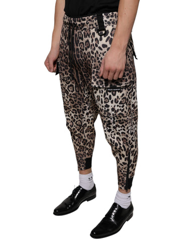 Brown leopard print polyester jogger pants by Dolce & Gabbana, featuring an elastic waistband and relaxed fit.