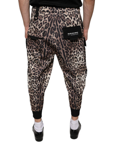 Brown leopard print polyester jogger pants by Dolce & Gabbana, featuring comfortable elastic waistband and tapered fit.