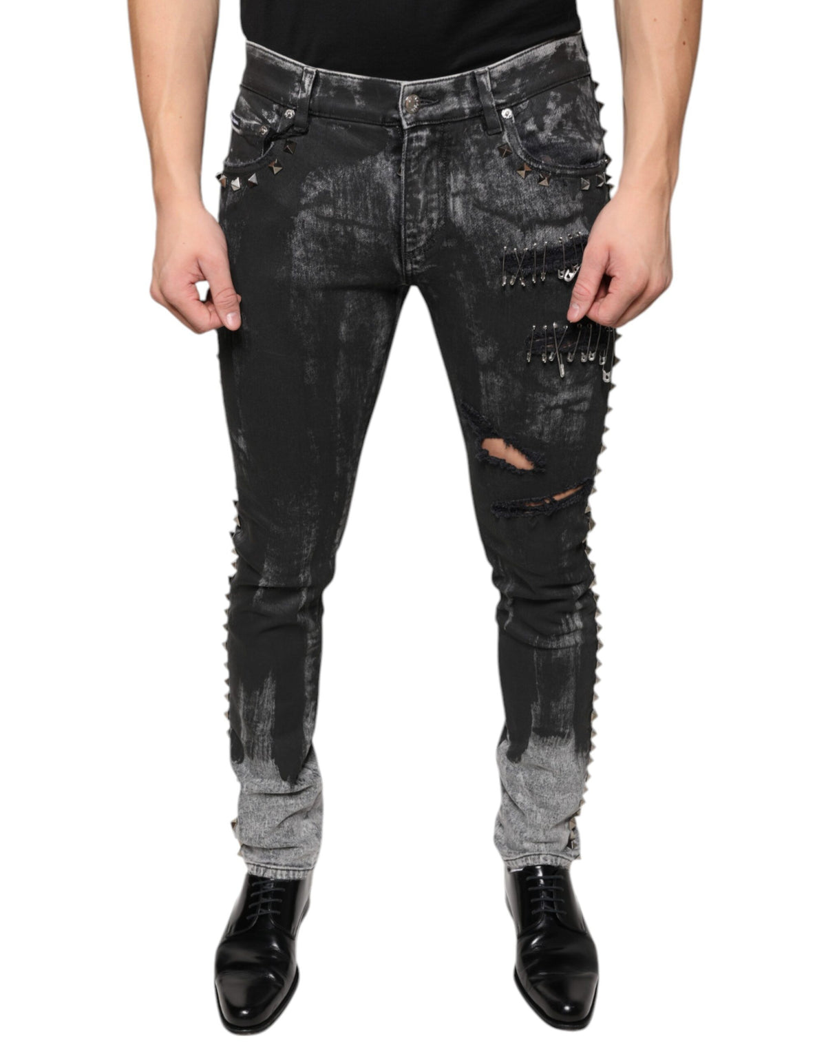 Black embellished cotton skinny denim jeans by Dolce & Gabbana, showing intricate embellishments and fitted style.