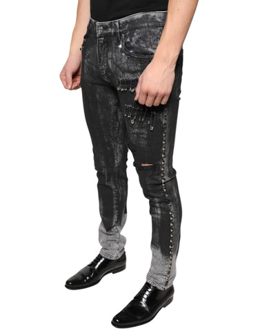 Black embellished cotton skinny denim jeans by Dolce & Gabbana with decorative details and a fitted silhouette.