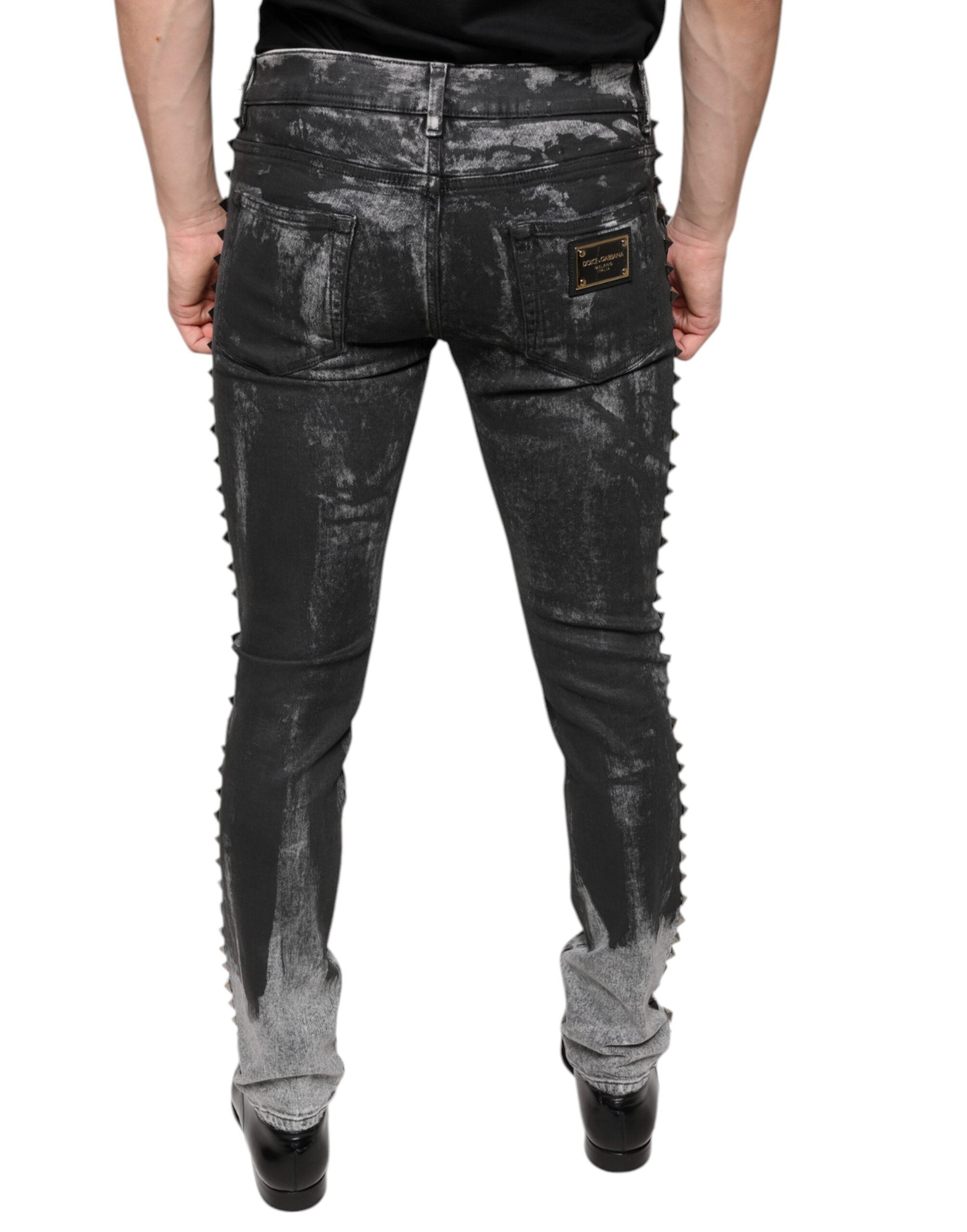 Black embellished cotton skinny denim jeans by Dolce & Gabbana with decorative details and a fitted style.