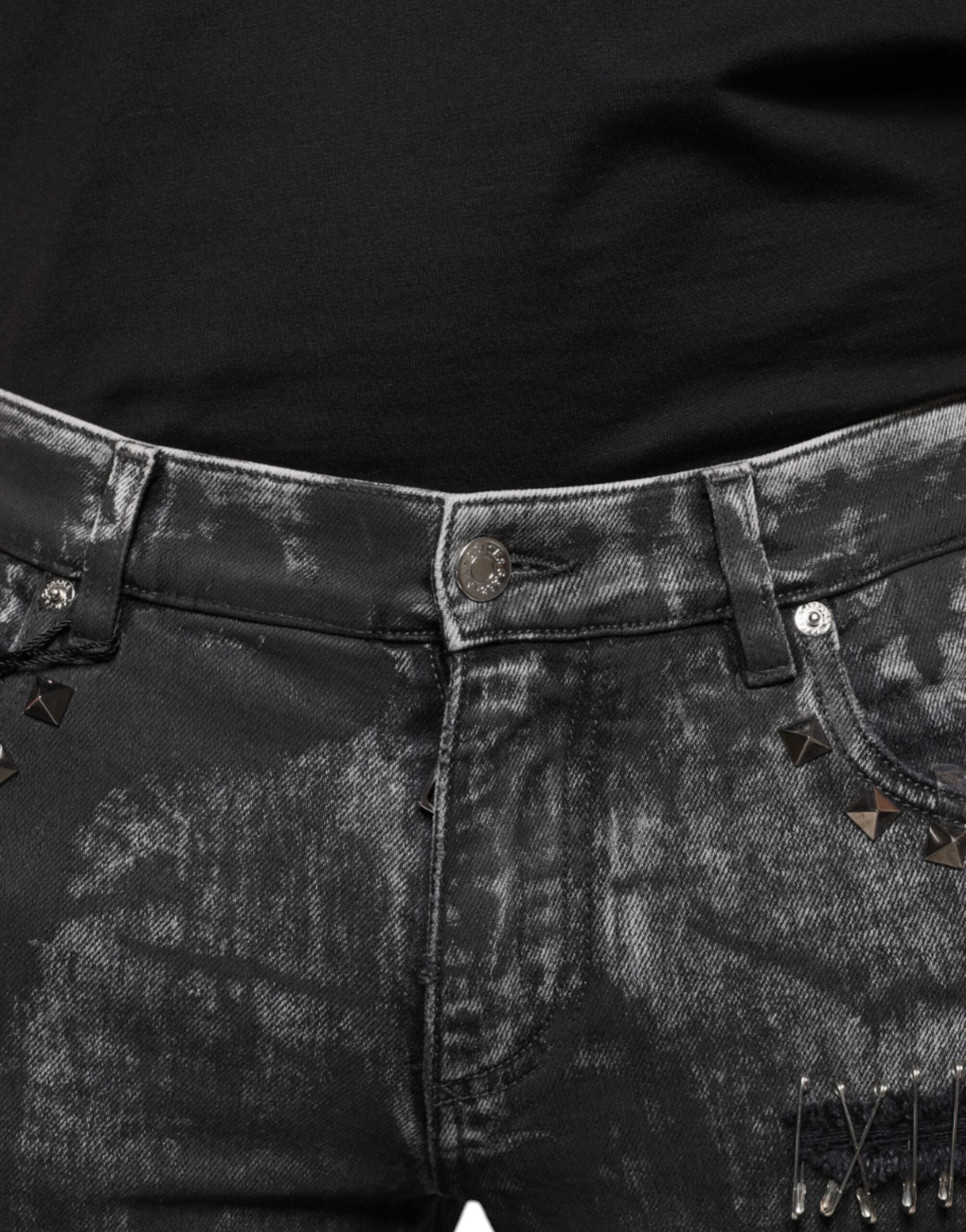 Black embellished cotton skinny denim jeans by Dolce & Gabbana with decorative details and a fitted silhouette.