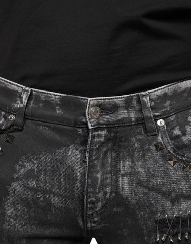 Black embellished cotton skinny denim jeans by Dolce & Gabbana with decorative details and a fitted silhouette.