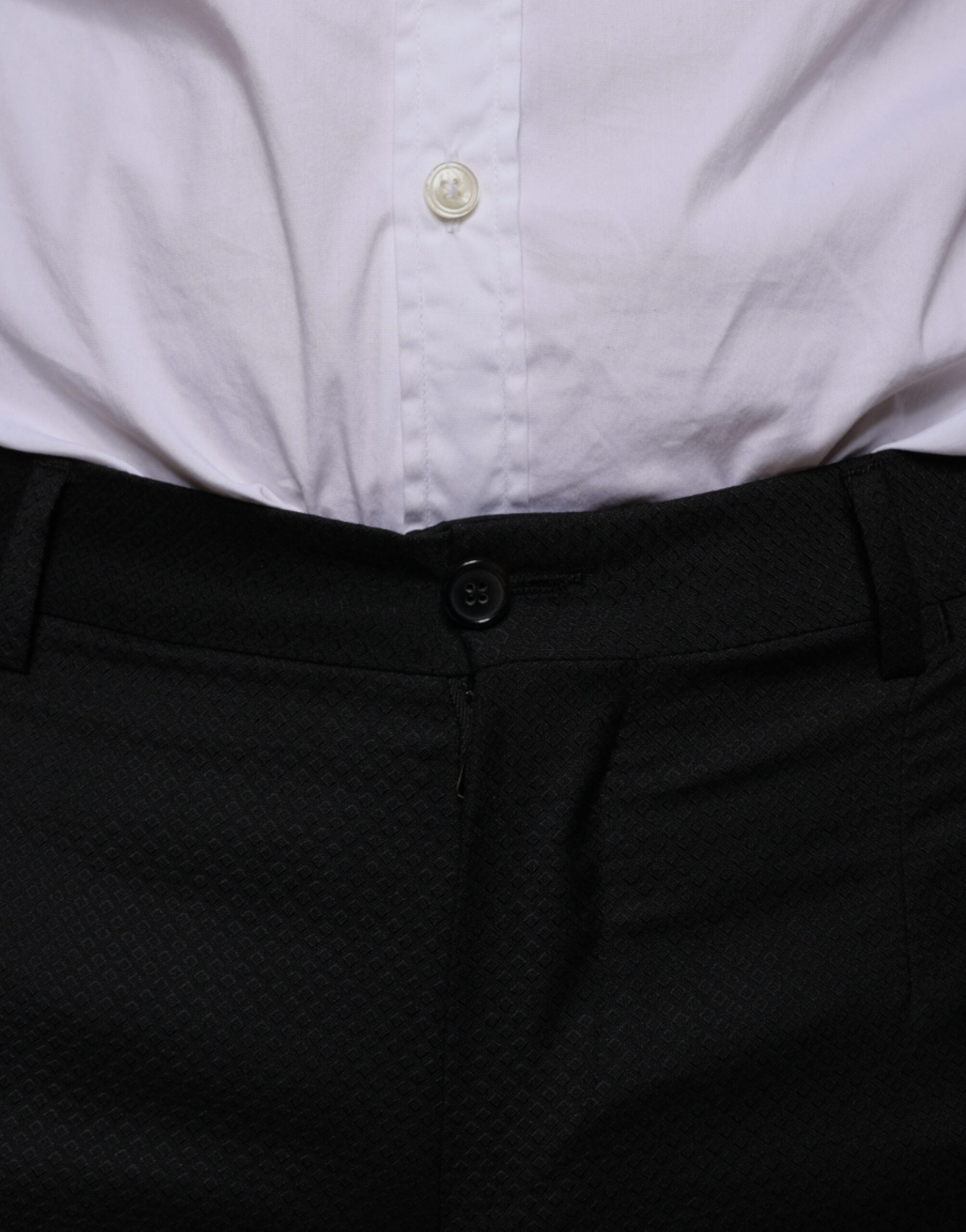 Black wool skinny dress pants by Dolce & Gabbana, tailored formal pants with a slim fit and sleek design.