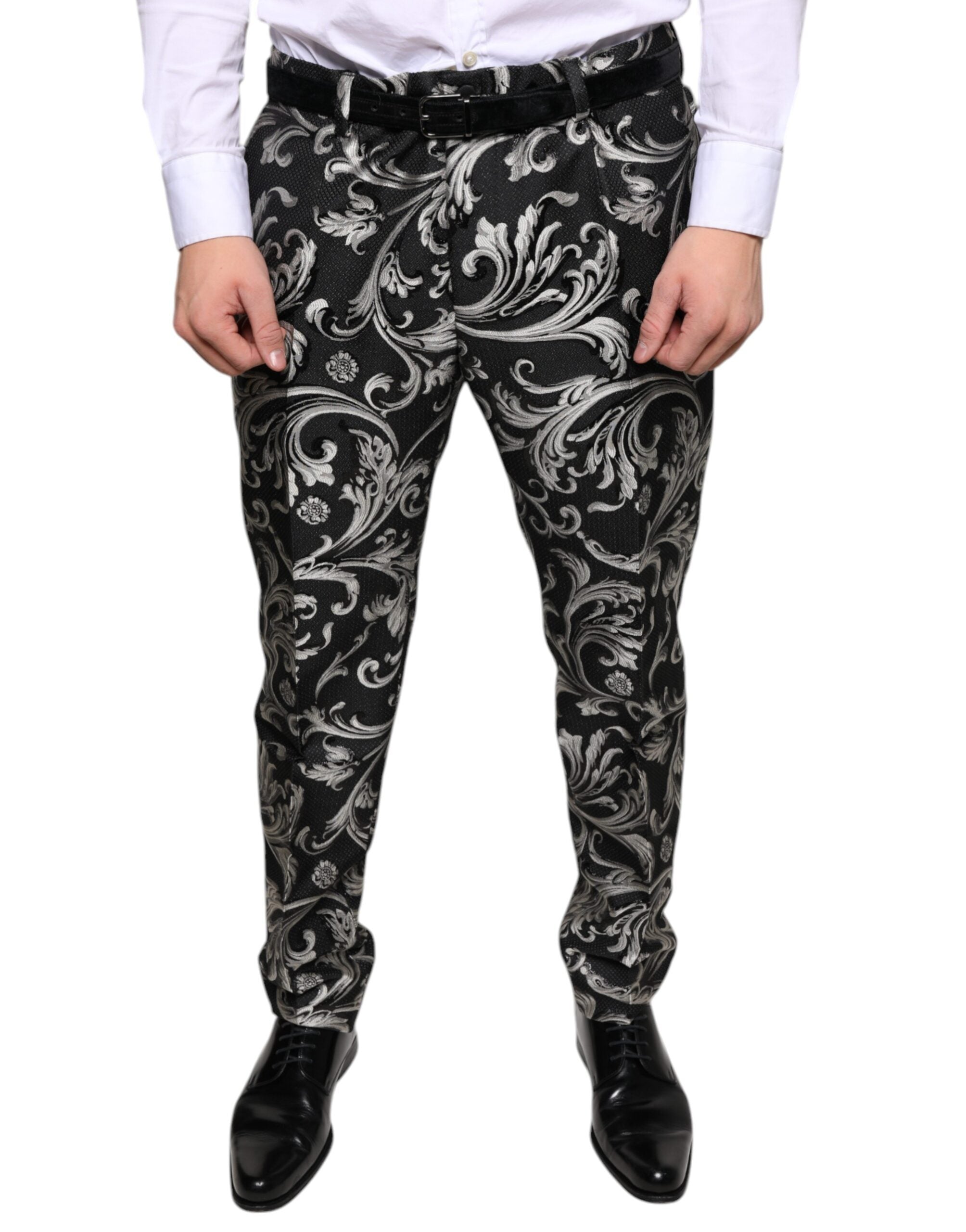 Black jacquard skinny dress pants by Dolce & Gabbana, showing tailored fit and intricate woven pattern.