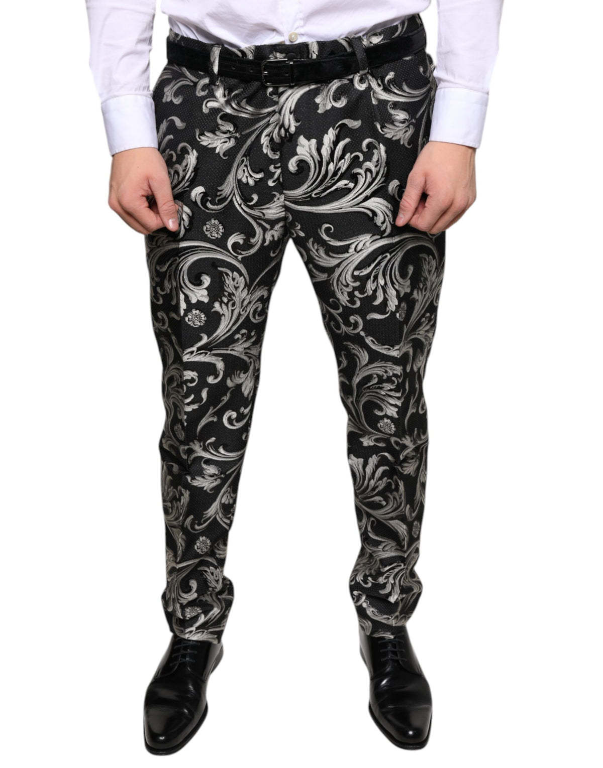 Black jacquard skinny dress pants by Dolce & Gabbana, showing tailored fit and intricate woven pattern.