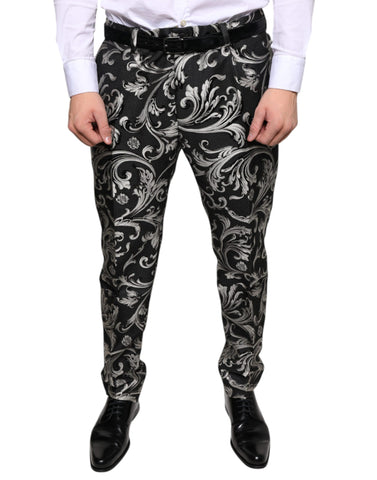 Black jacquard skinny dress pants by Dolce & Gabbana, showing tailored fit and intricate woven pattern.