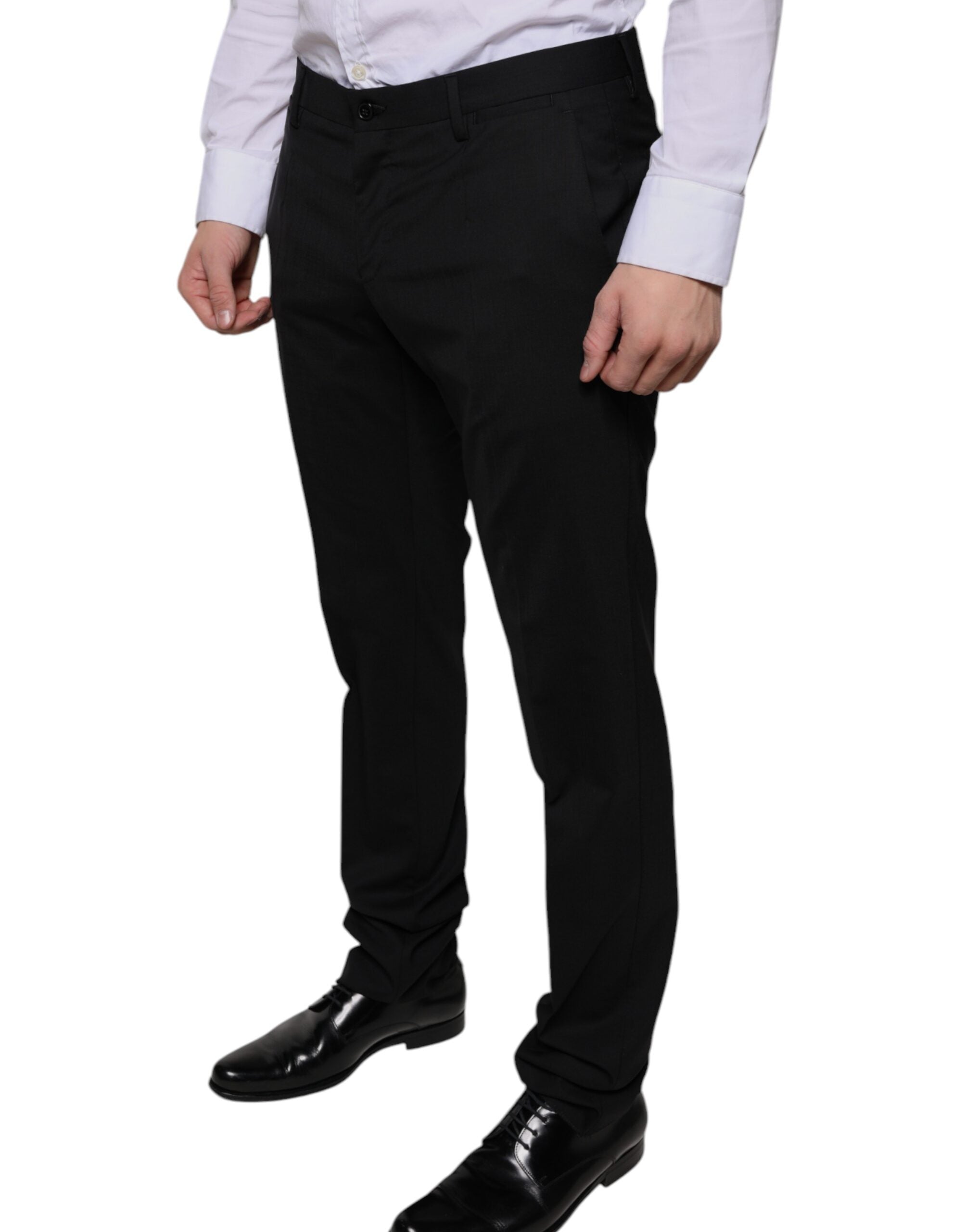 Black wool skinny dress pants by Dolce & Gabbana, tailored formal pants with a slim fit and sleek design.