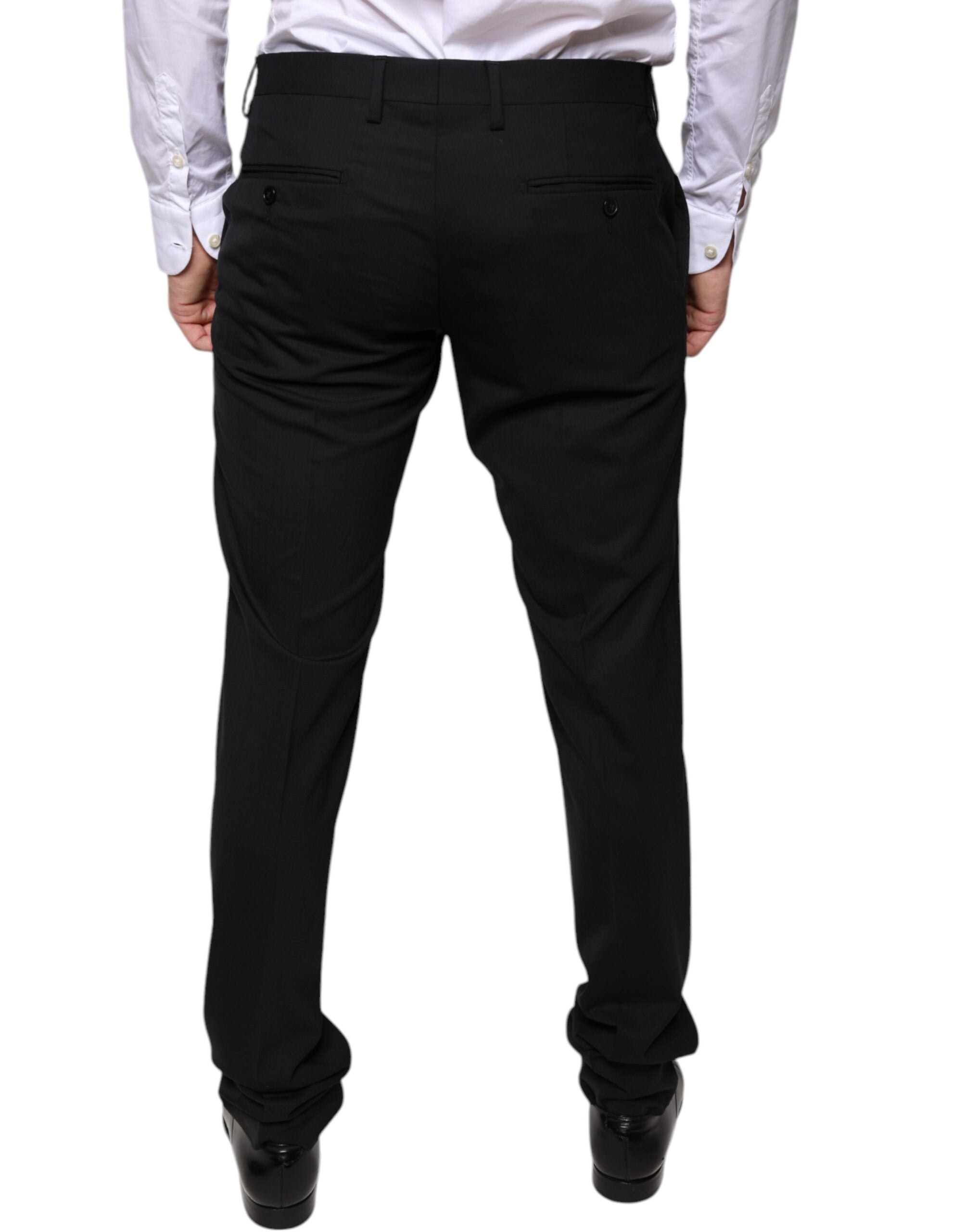Black wool skinny dress pants by Dolce & Gabbana, tailored formal pants with a sleek, fitted silhouette and classic style.