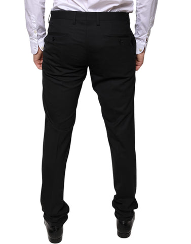 Black wool skinny dress pants by Dolce & Gabbana, tailored formal pants with a sleek, fitted silhouette and classic style.