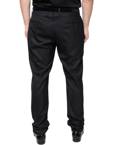 Black wool skinny dress pants by Dolce & Gabbana, tailored formal pants with a sleek fit, shown on a model.