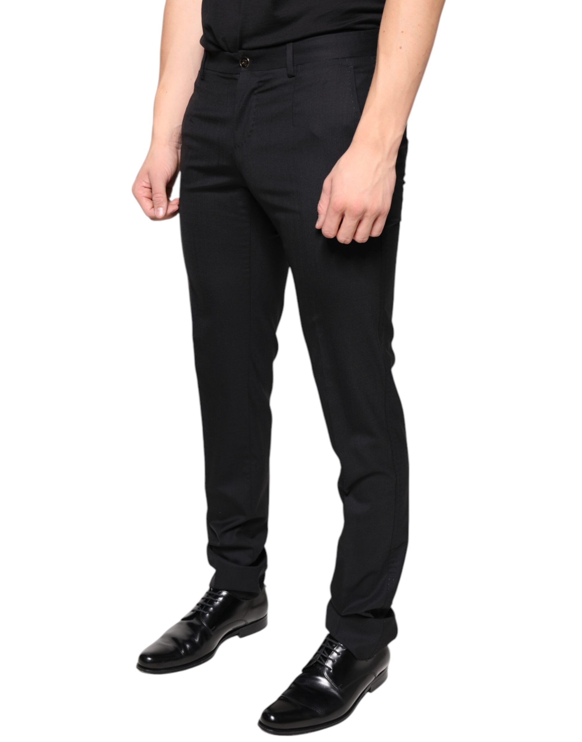 Black wool skinny men's dress pants by Dolce & Gabbana, tailored fit with sleek design and classic style.