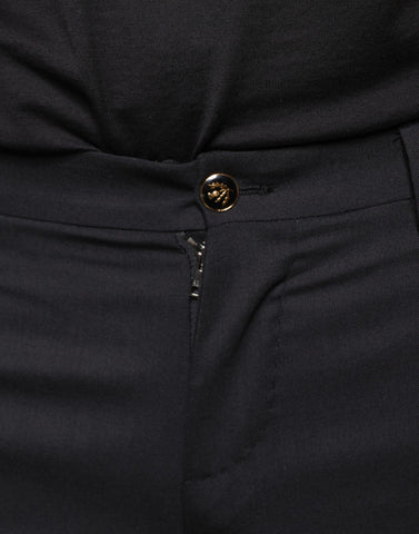 Black wool skinny men's dress pants by Dolce & Gabbana, showing tailored fit and sleek design.