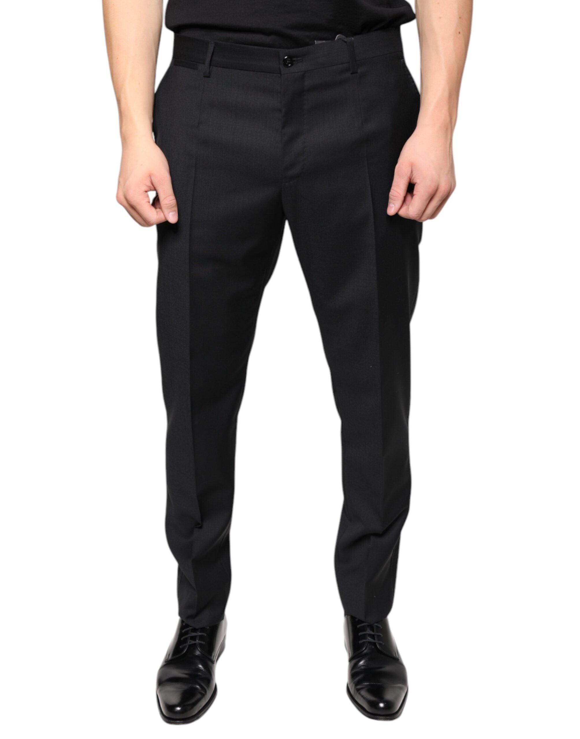Black wool skinny men's dress pants by Dolce & Gabbana, tailored fit with sleek design, showcased on a neutral background.