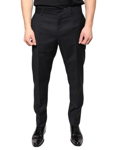 Black wool skinny men's dress pants by Dolce & Gabbana, tailored fit with sleek design, showcased on a neutral background.