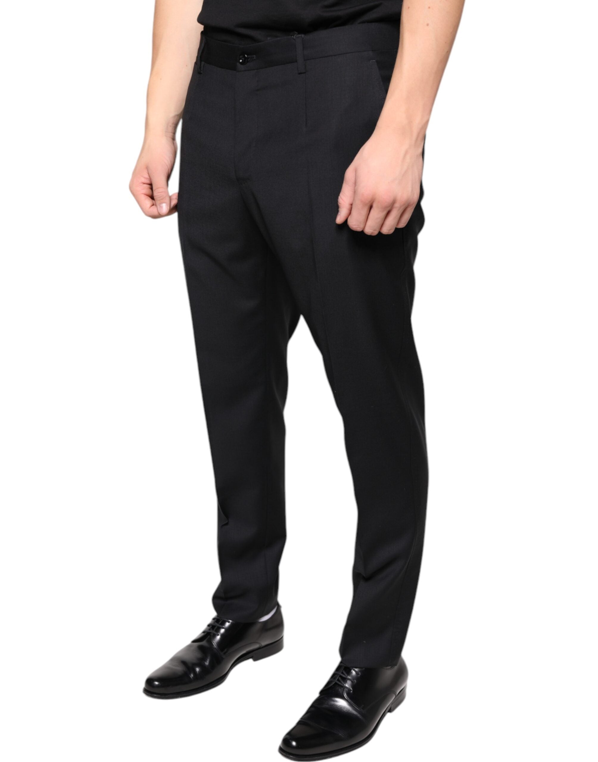 Black wool skinny men's dress pants by Dolce & Gabbana, tailored fit with smooth fabric and classic styling.