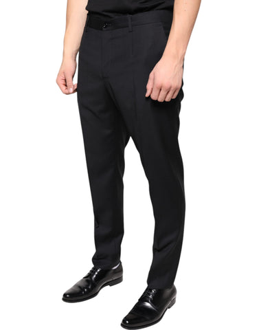 Black wool skinny men's dress pants by Dolce & Gabbana, tailored fit with smooth fabric and classic styling.