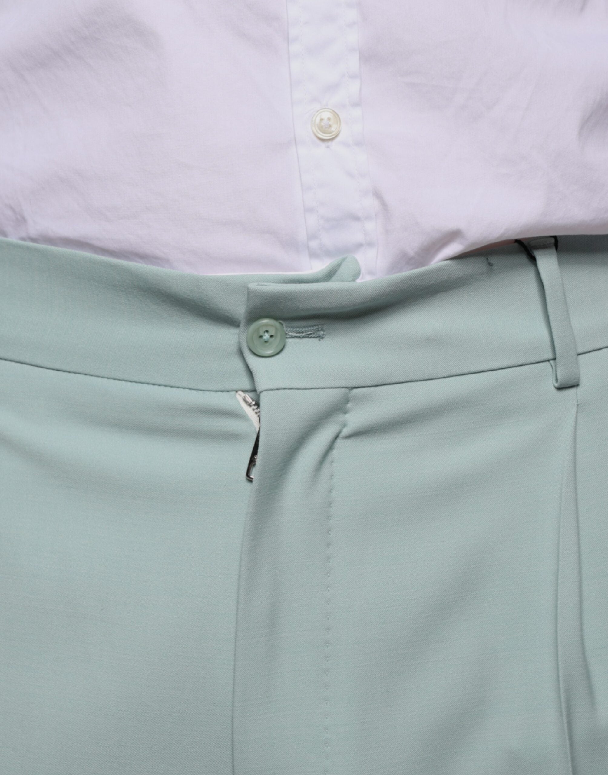 Mint green cotton dress pants by Dolce & Gabbana, tailored fit with belt loops and front pockets, displayed on a plain background.