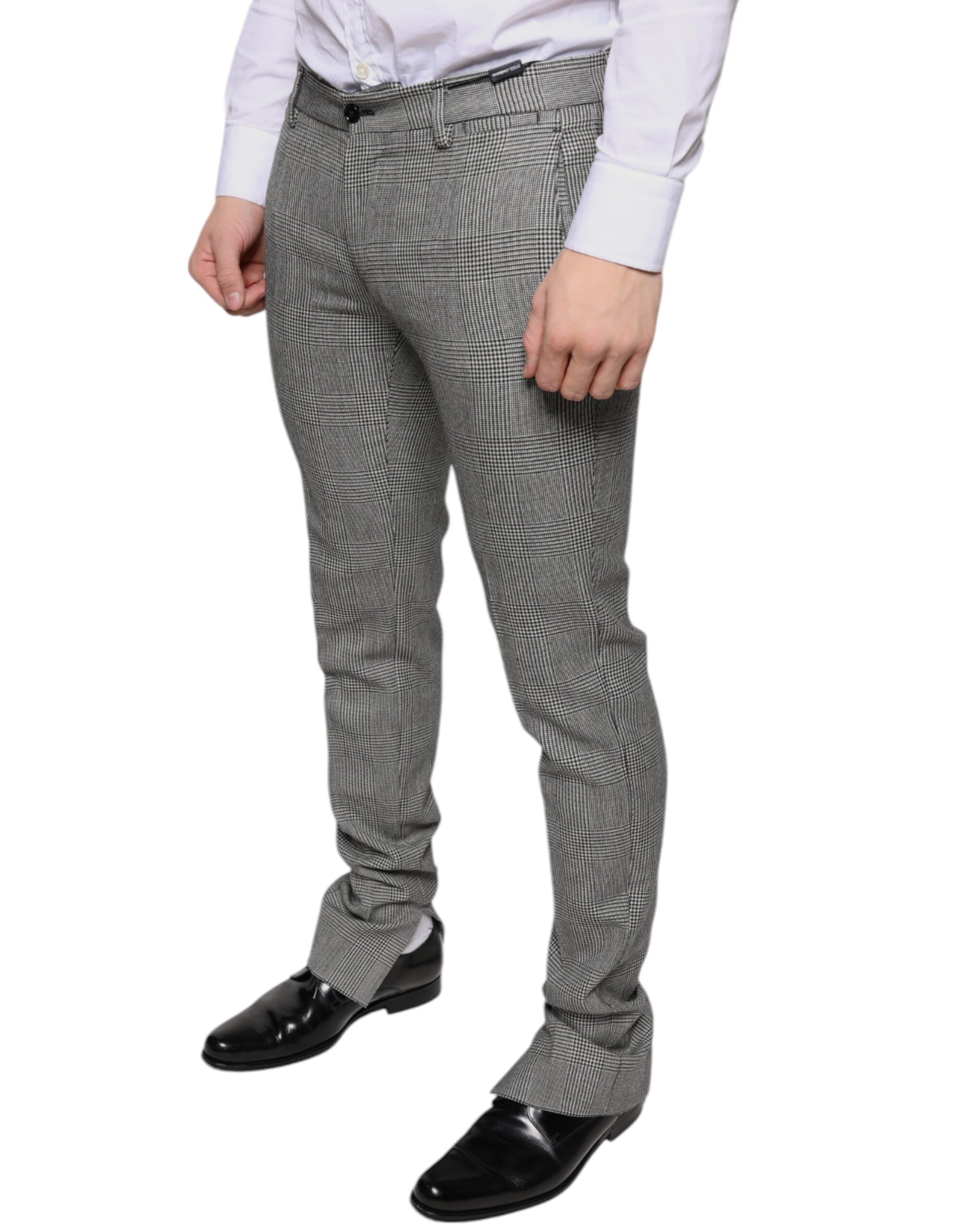 Gray check tartan wool skinny pants by Dolce & Gabbana, featuring a tailored fit and classic plaid pattern.