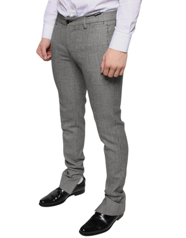 Gray check tartan wool skinny pants by Dolce & Gabbana, featuring a tailored fit and classic plaid pattern.