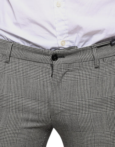 Gray check tartan wool skinny pants by Dolce & Gabbana, featuring a tailored fit and classic plaid pattern.