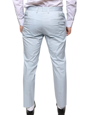 Light blue cotton dress pants from Dolce & Gabbana, tailored fit with classic style and belt loops, shown on a hanger.