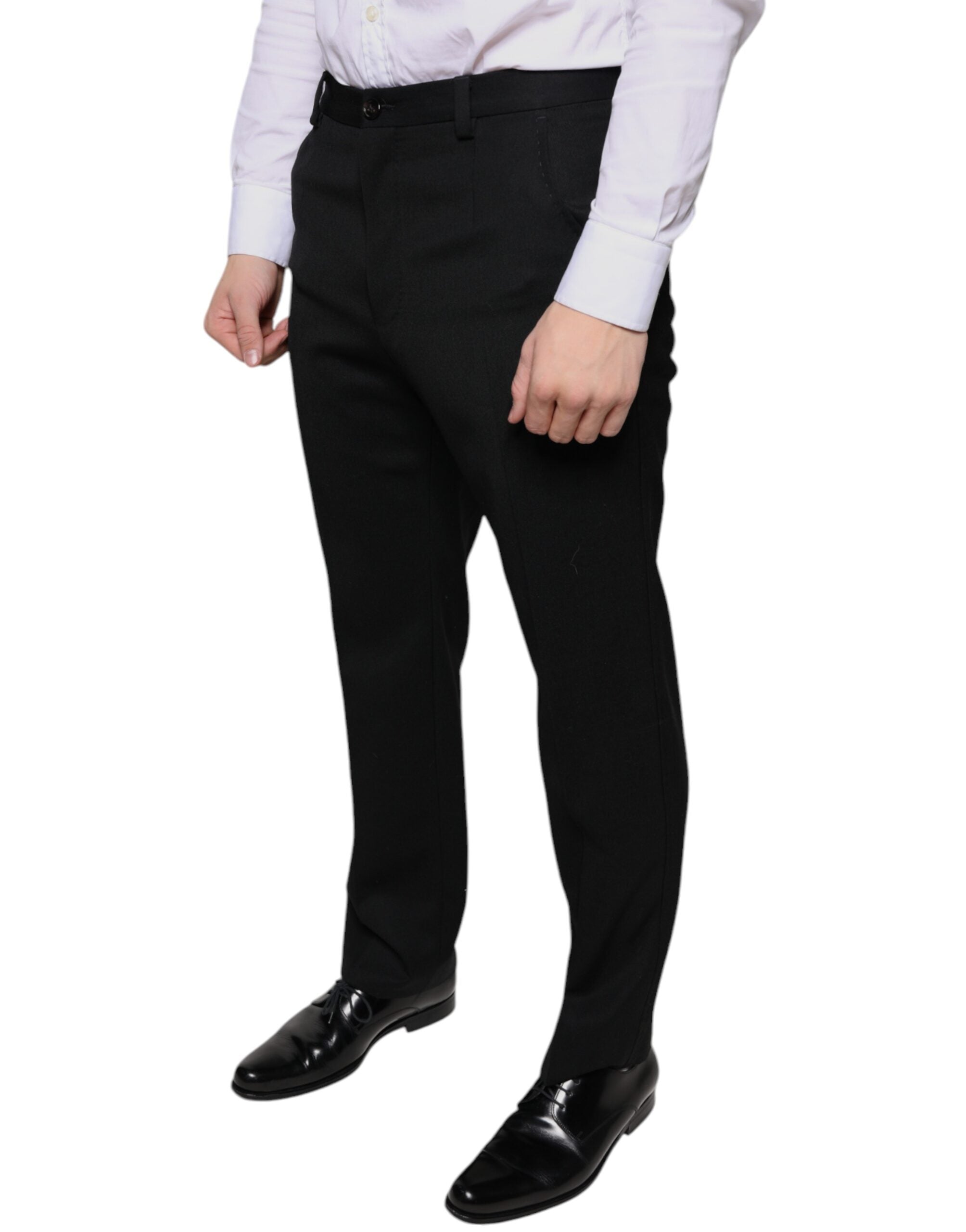 Black wool skinny men's dress pants by Dolce & Gabbana, tailored fit with smooth fabric and classic ankle length.