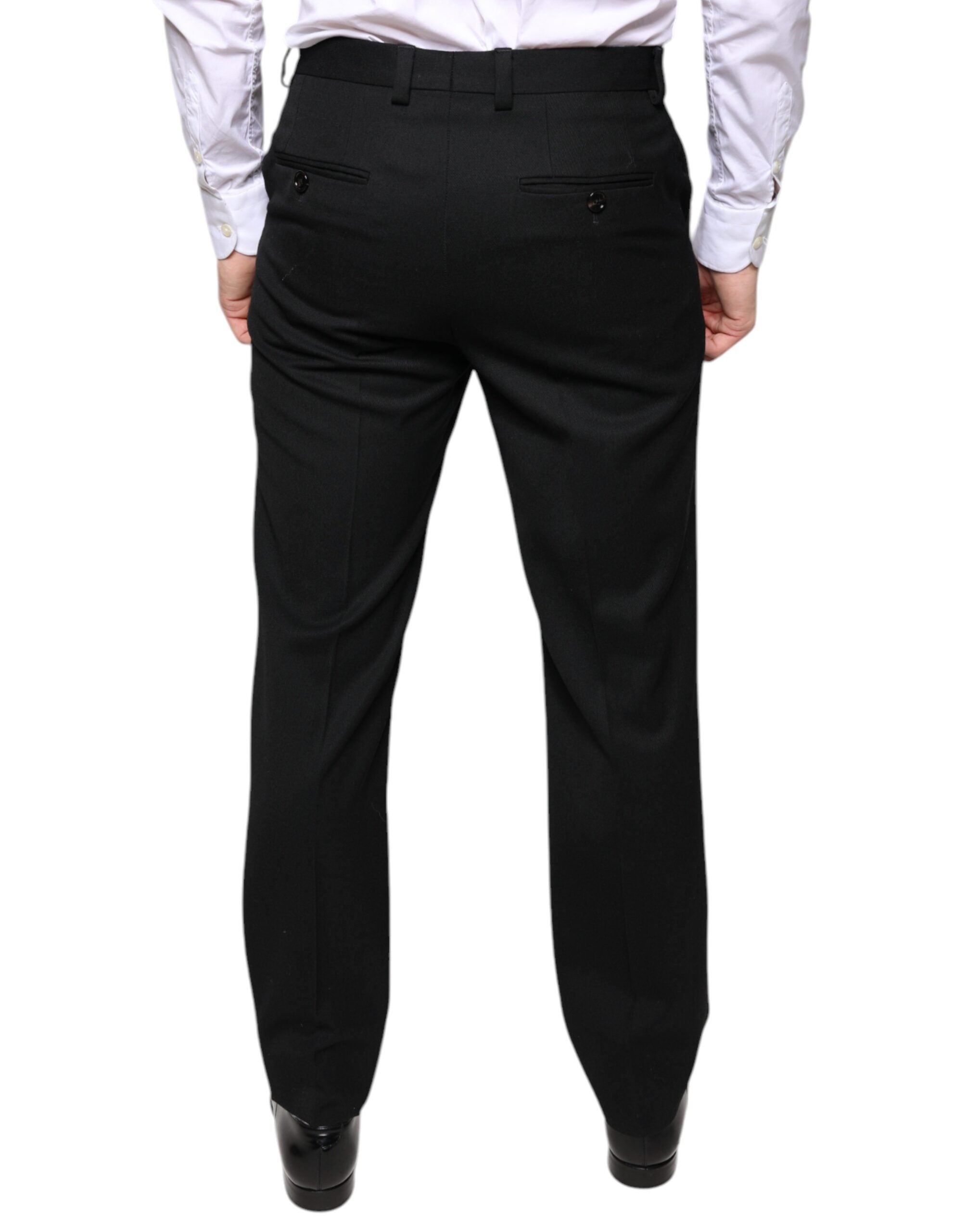 Black wool skinny men's dress pants by Dolce & Gabbana, tailored fit with sleek waistband and classic styling.